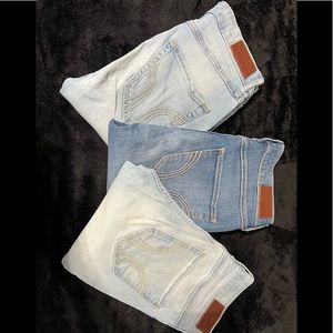 EUC Hollister Womens 0L skinny jeans. 2 light blue and one medium blue.